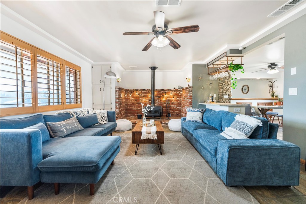 7071 Rubidoux Avenue Yucca Valley, CA 92284 - Photo 38 of 50 a living room with furniture and a large window