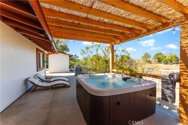 a view of swimming pool with seating space