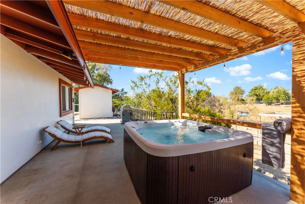 7071 Rubidoux Avenue Yucca Valley, CA 92284 - Photo 43 of 50 a dining room with furniture and a floor to ceiling window
