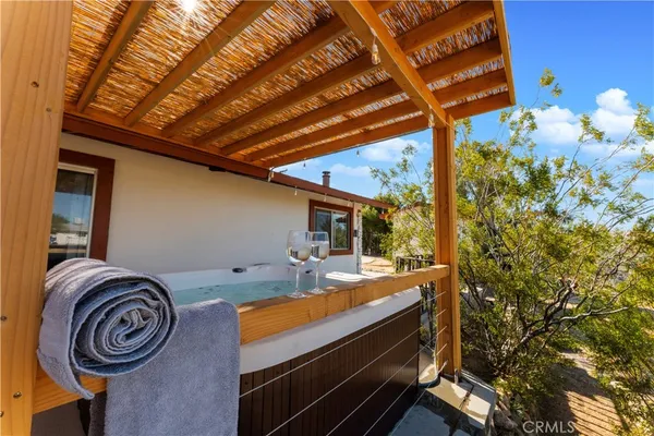 a backyard of a house with table and chairs