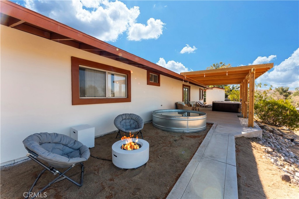 7071 Rubidoux Avenue Yucca Valley, CA 92284 - Photo 50 of 50 a dining room with furniture and a potted plant