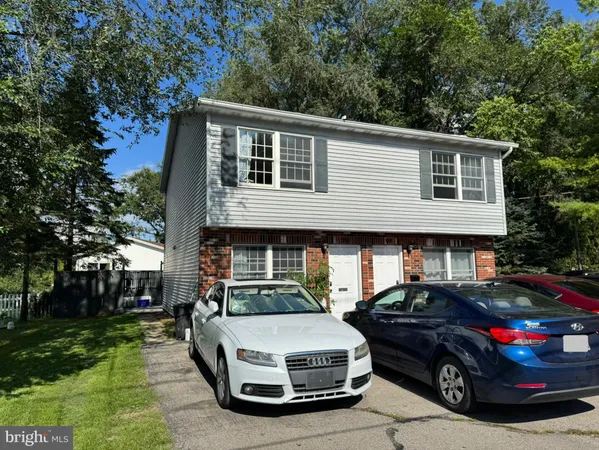 a car parked in front of a house