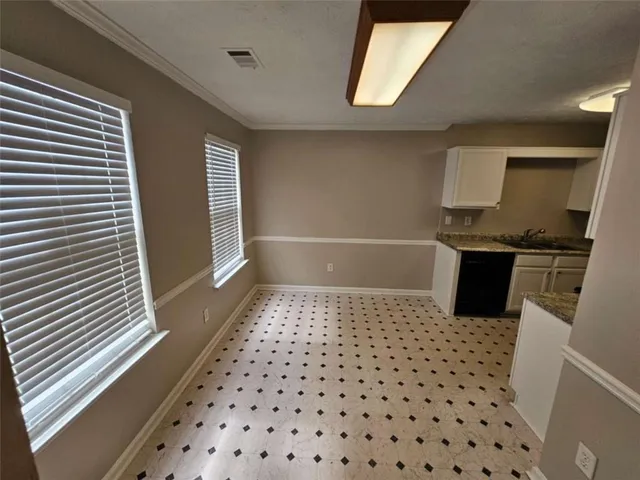 a bathroom with a sink a toilet a mirror and shower