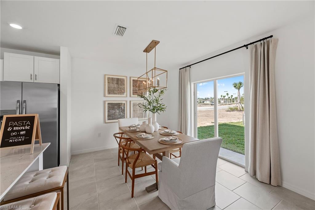 17251 Monte Isola Way North Fort Myers, FL 33917 - Photo 15 of 39 a dining room with furniture and window