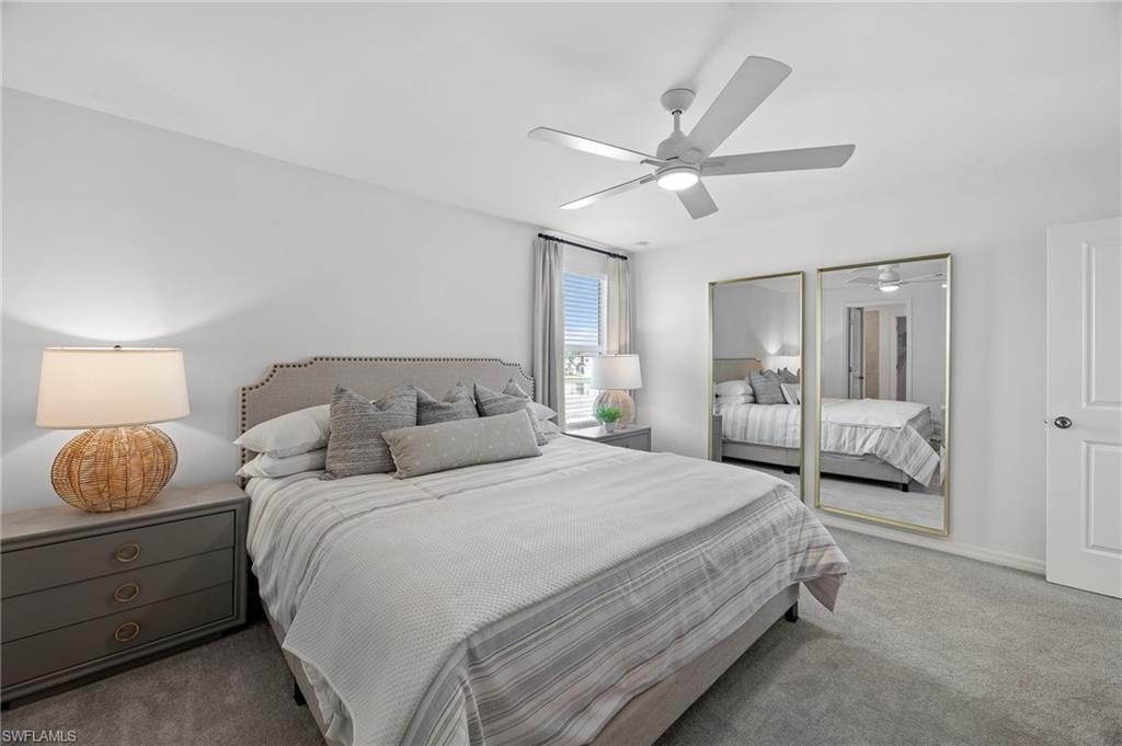 17251 Monte Isola Way North Fort Myers, FL 33917 - Photo 28 of 39 a bedroom with a bed and window