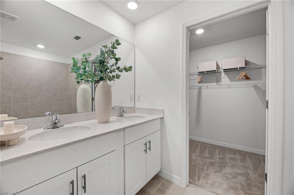 17251 Monte Isola Way North Fort Myers, FL 33917 - Photo 29 of 39 a bathroom with a sink and a mirror