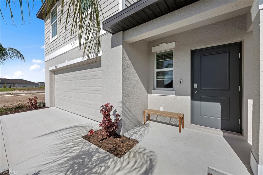 17251 Monte Isola Way North Fort Myers, FL 33917 - Photo 3 of 39 a view of a porch with a bench