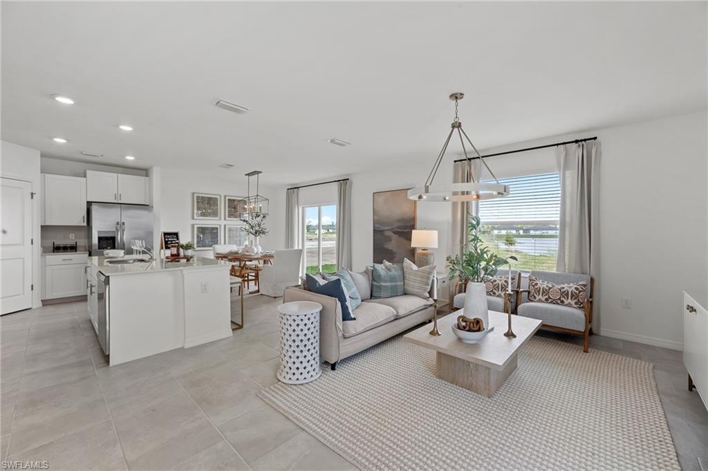 17251 Monte Isola Way North Fort Myers, FL 33917 - Photo 6 of 39 a living room with furniture and view of kitchen