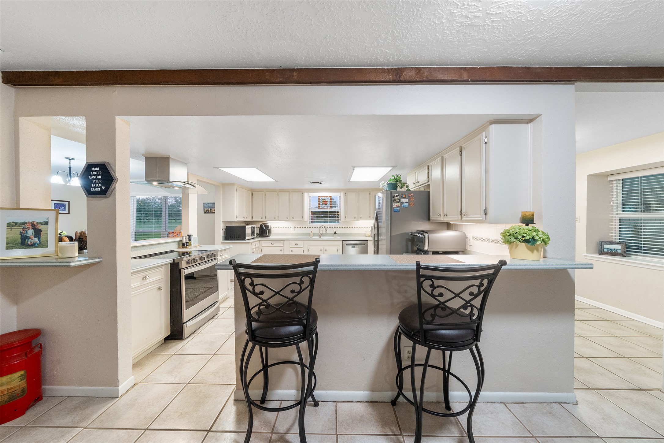 21348 Farm To Market 359 Hempstead, TX 77445 - Photo 11 of 48 a dining hall with stainless steel appliances kitchen island granite countertop a dining table and chairs