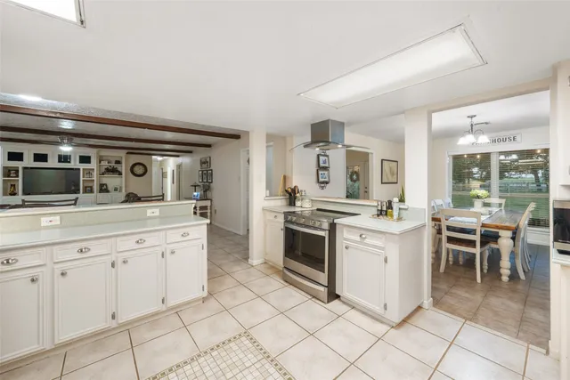 a bathroom with a double vanity sink a mirror and a bathtub