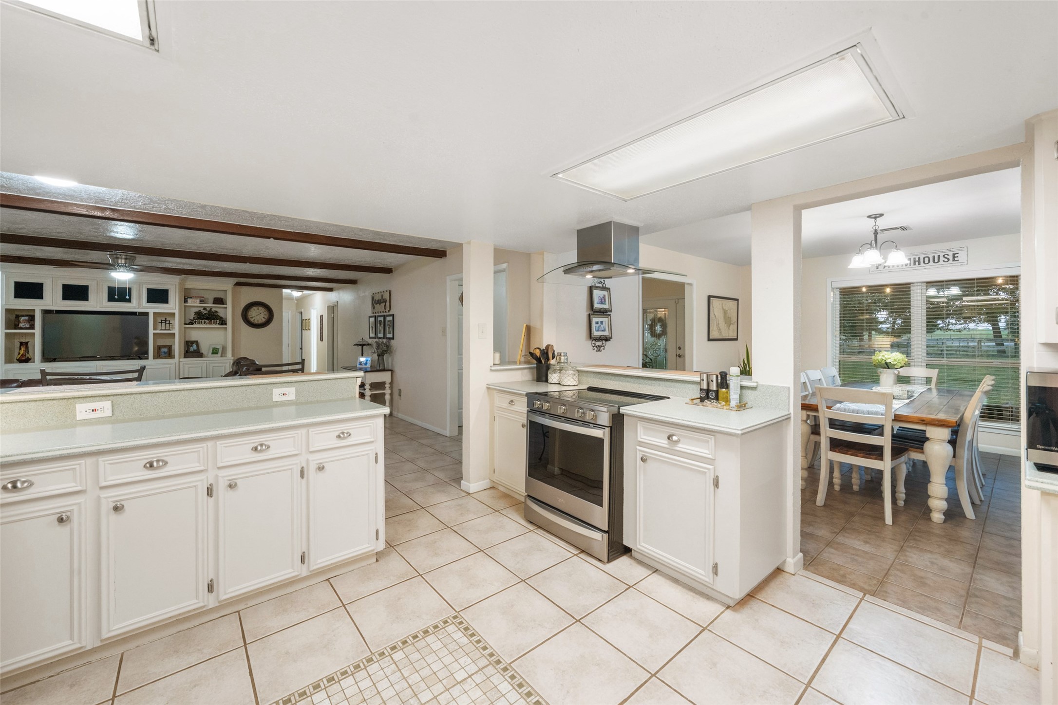 21348 Farm To Market 359 Hempstead, TX 77445 - Photo 14 of 48 a kitchen with a sink and chairs