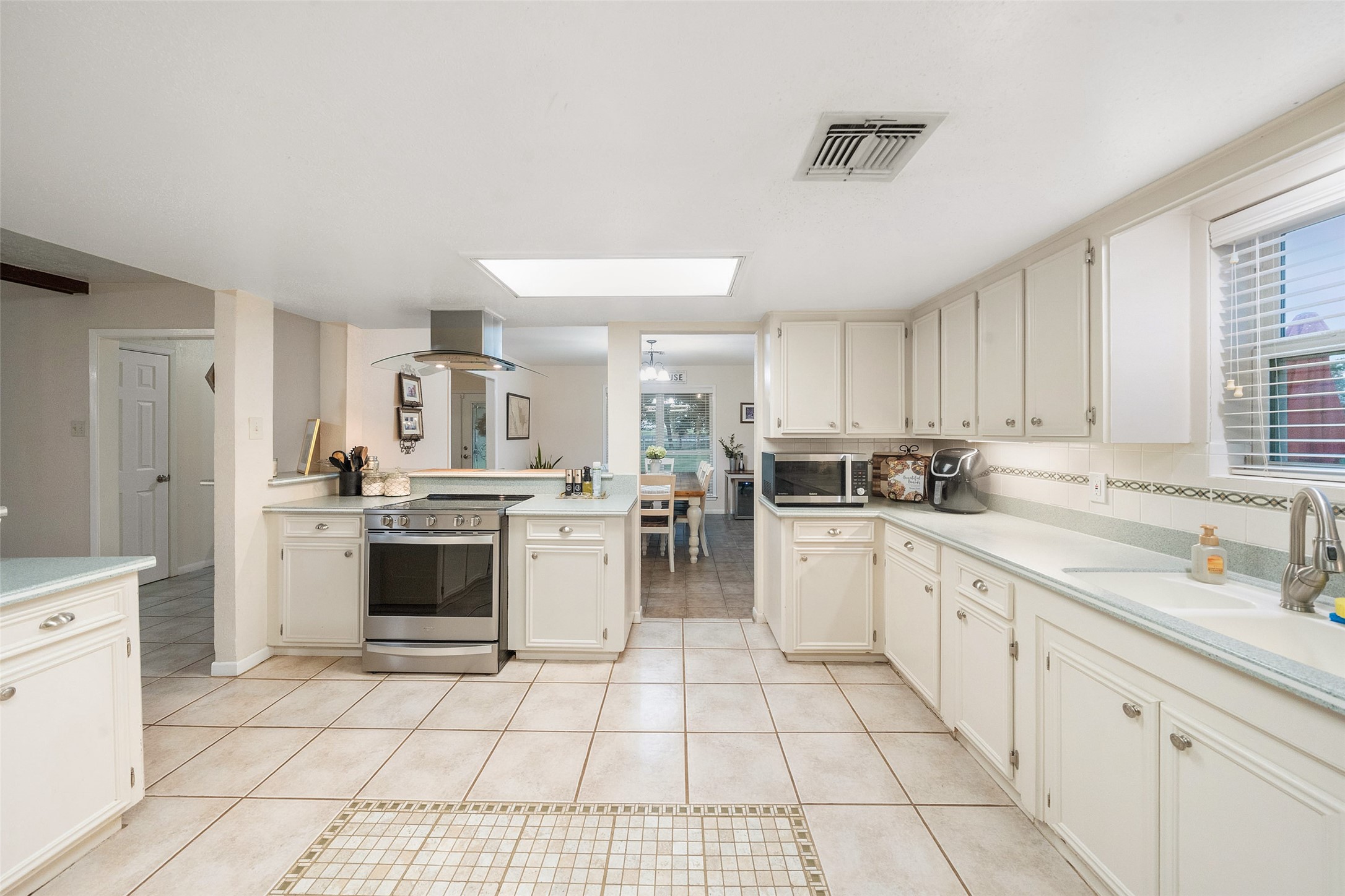 21348 Farm To Market 359 Hempstead, TX 77445 - Photo 15 of 48 a kitchen with a sink cabinets and window