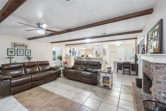a spacious bedroom with a large bed and a window