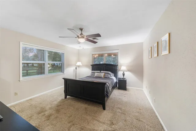 a backyard of a house with lots of green space and garden