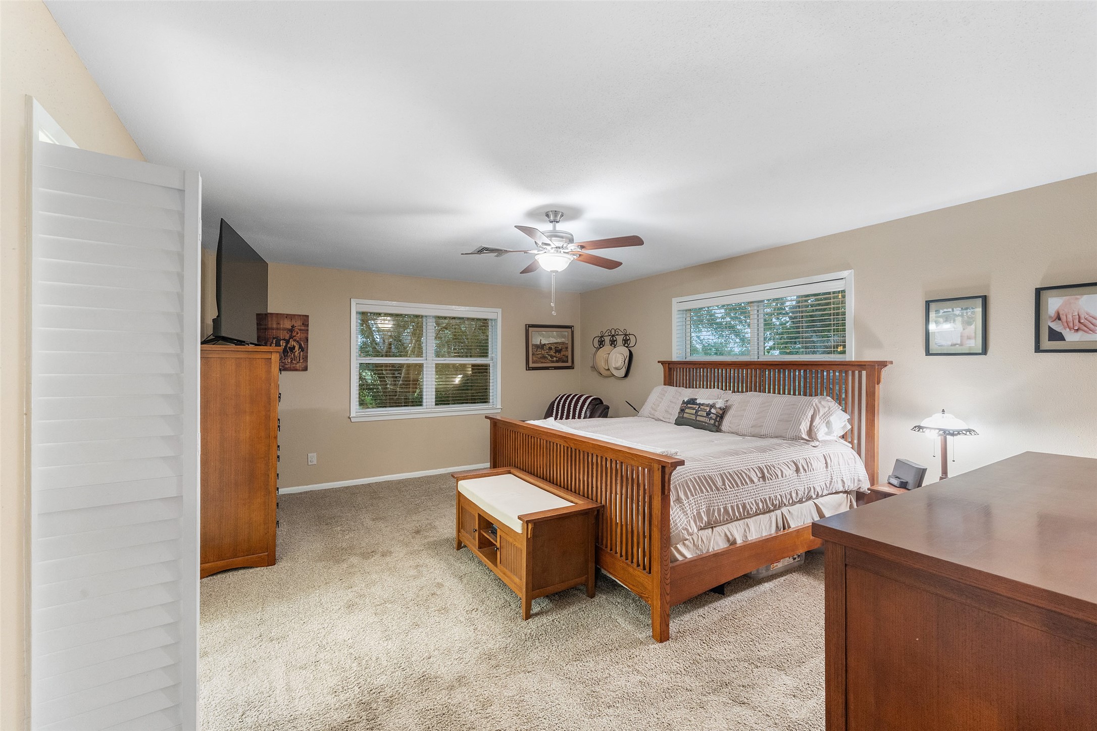 21348 Farm To Market 359 Hempstead, TX 77445 - Photo 23 of 48 a spacious bedroom with a large bed and a window