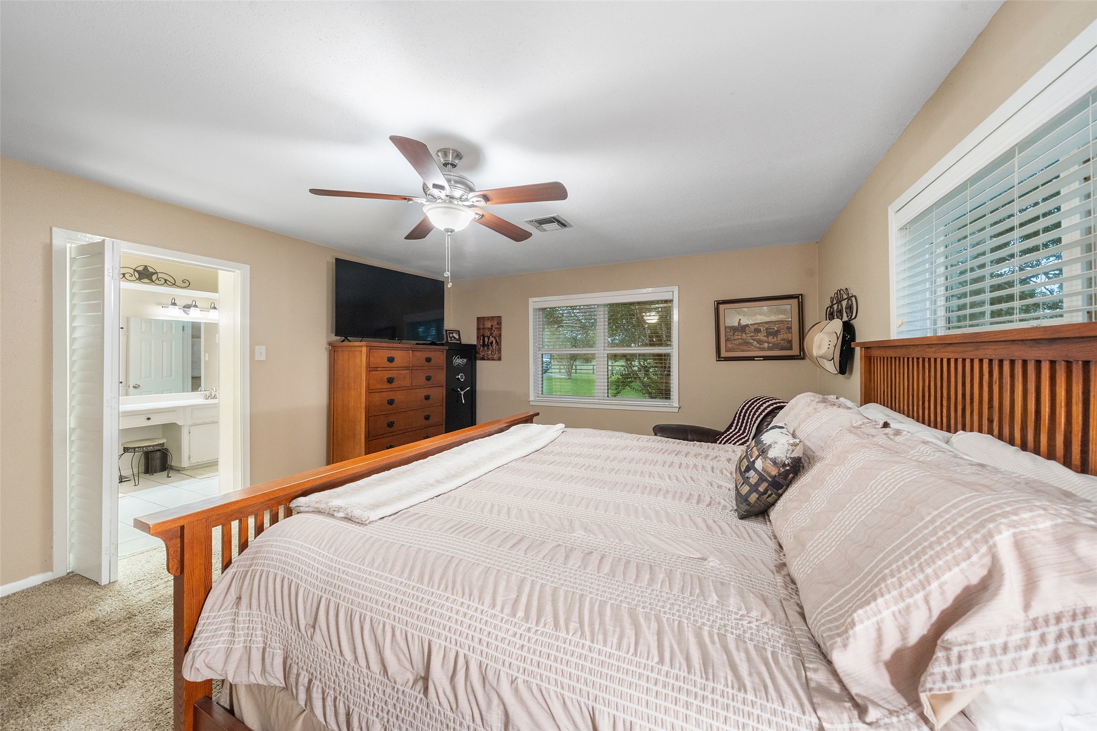 21348 Farm To Market 359 Hempstead, TX 77445 - Photo 24 of 48 a bedroom with a large bed and a window