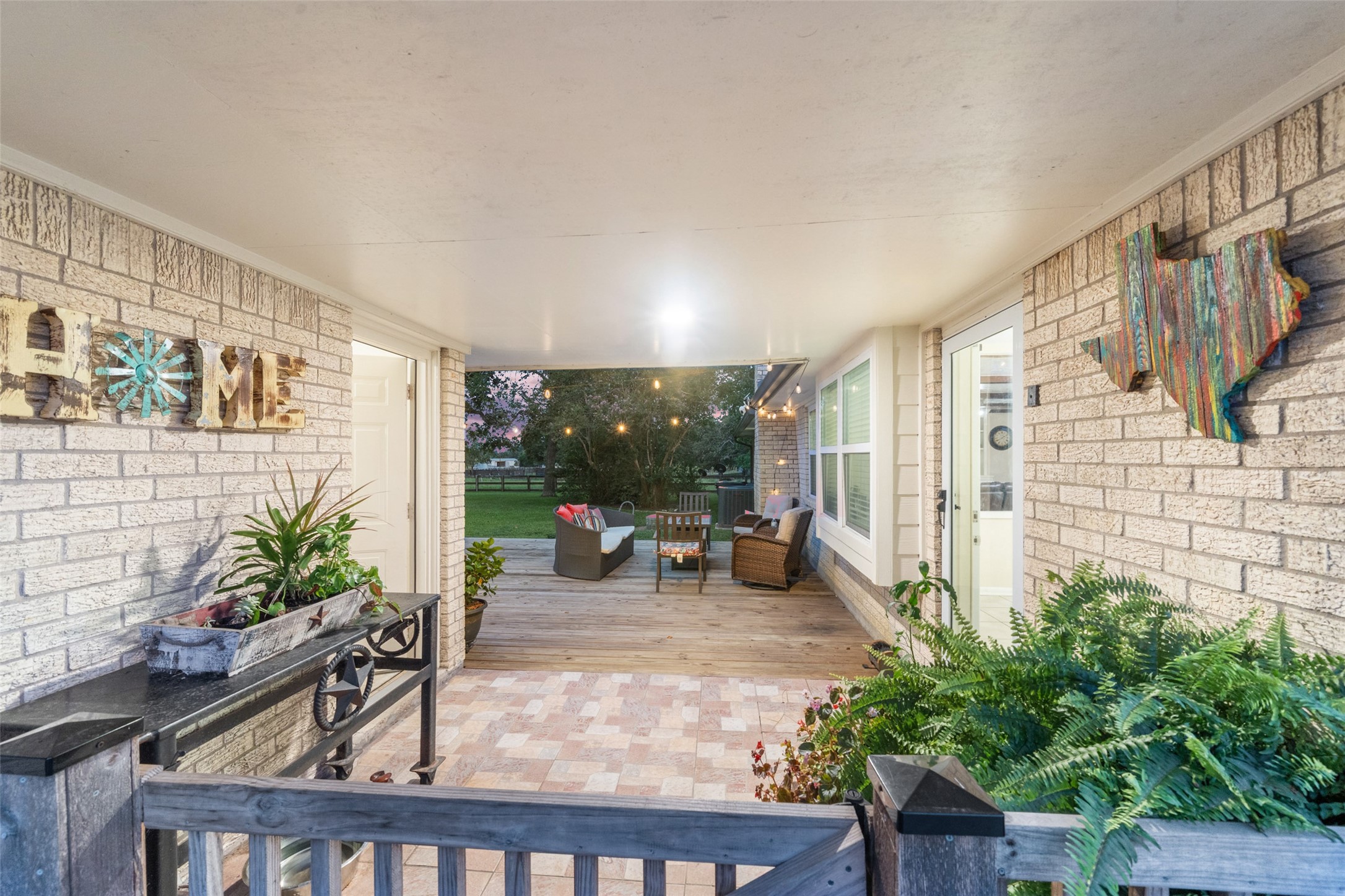 21348 Farm To Market 359 Hempstead, TX 77445 - Photo 27 of 48 Back porch opens to a newly built deck with upgraded exterior doors and added French drains for improved drainage.