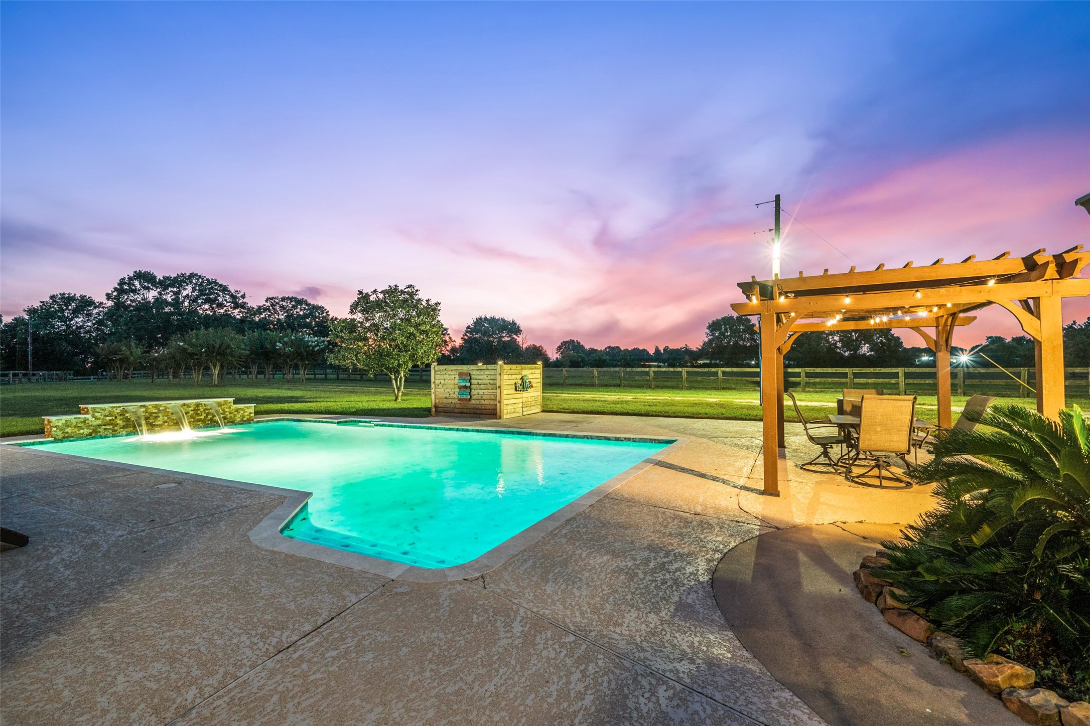 21348 Farm To Market 359 Hempstead, TX 77445 - Photo 29 of 48 a view of a swimming pool with a yard and a fountain