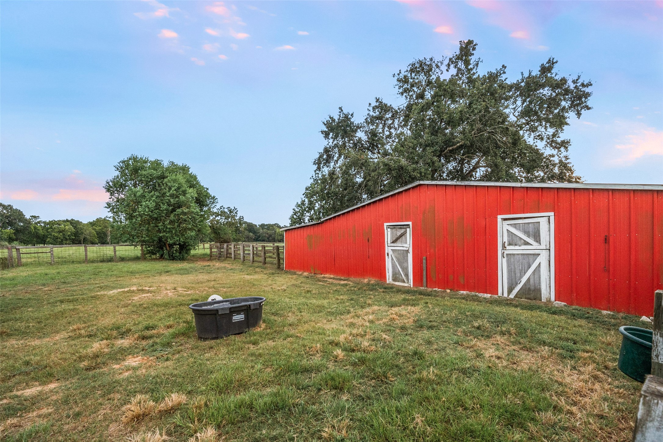21348 Farm To Market 359 Hempstead, TX 77445 - Photo 41 of 48 Alternate barn view highlights sliding doors and ample space for feed or tack storage.