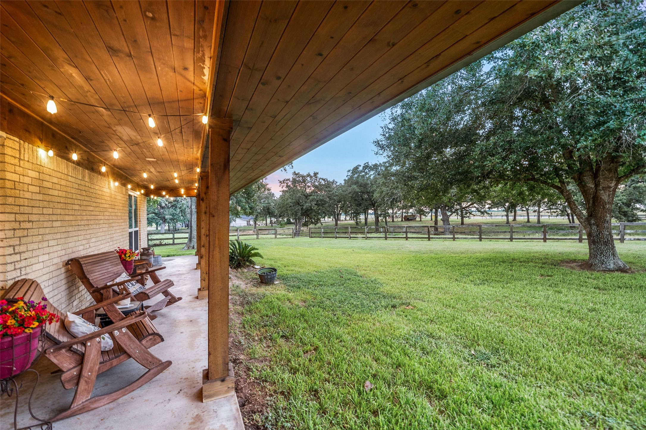 21348 Farm To Market 359 Hempstead, TX 77445 - Photo 8 of 48 Covered porch with wood ceiling, cedar posts, and upgraded lighting creates a relaxing outdoor living space.