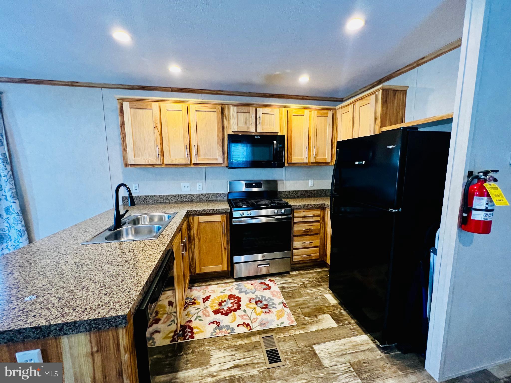 222 Kennedy Avenue Williamstown, NJ 08094 - Photo 3 of 10 a kitchen with granite countertop lots of refrigerator and furniture
