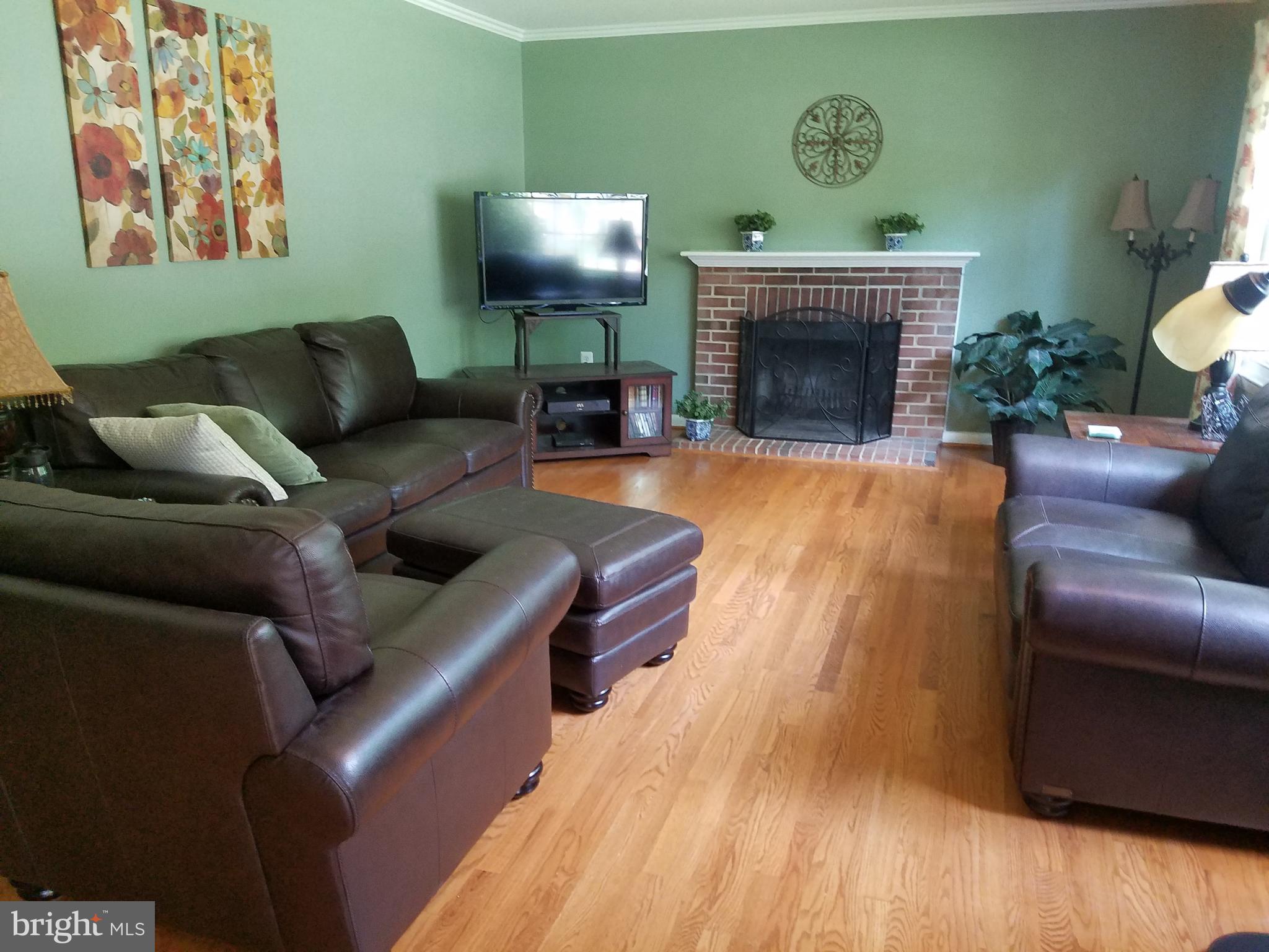 Roomy living room with wood-burning fireplace