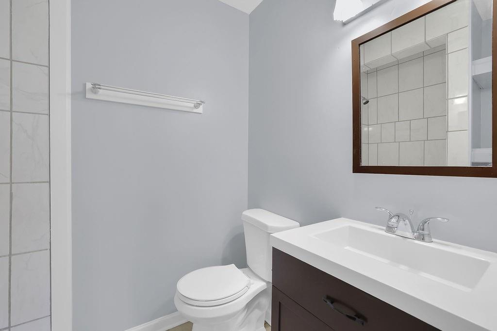 1424 Springleaf Circle Southeast Smyrna, GA 30080 - Photo 26 of 38 a bathroom with a sink toilet and vanity