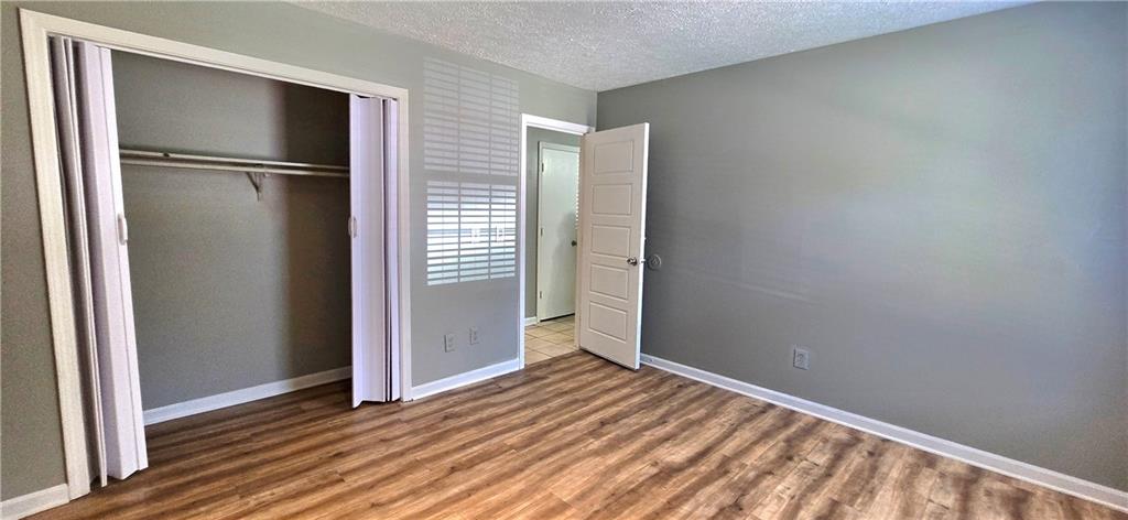 1120 Rappahannock Drive Alpharetta, GA 30009 - Photo 17 of 35 a view of an empty room with wooden floor and a window