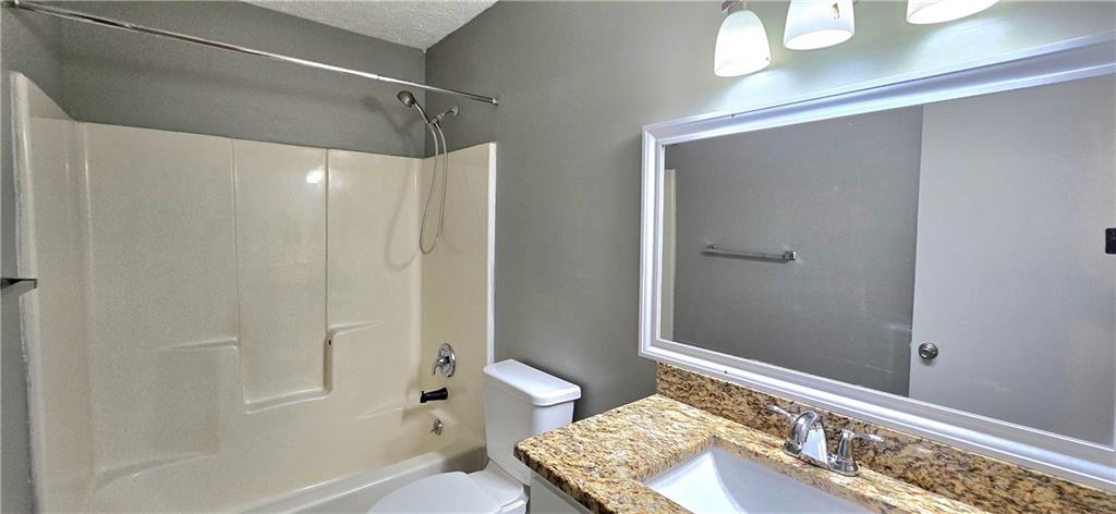 1120 Rappahannock Drive Alpharetta, GA 30009 - Photo 19 of 35 a bathroom with a granite countertop sink toilet and shower