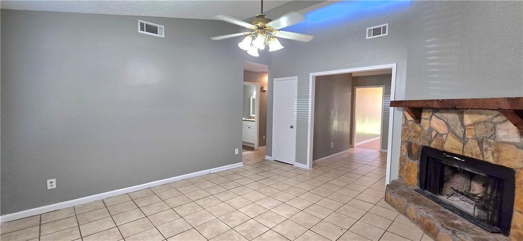 1120 Rappahannock Drive Alpharetta, GA 30009 - Photo 2 of 35 a view of an empty room with a fireplace and a chandelier fan