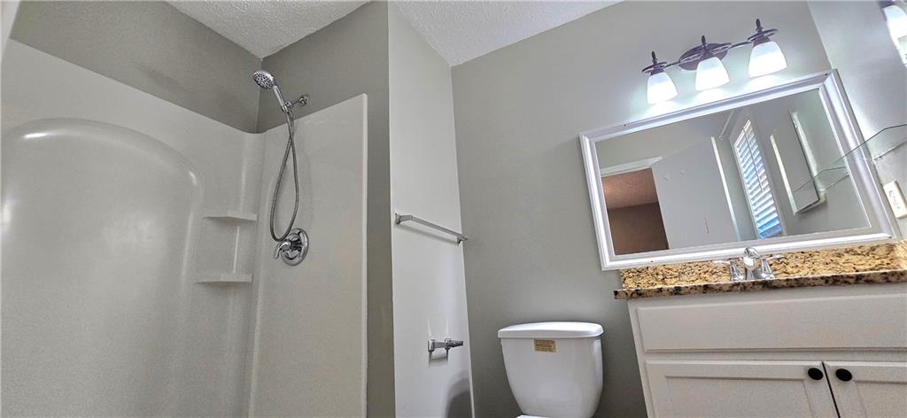 1120 Rappahannock Drive Alpharetta, GA 30009 - Photo 23 of 35 a bathroom with a light fixture a mirror and a sink