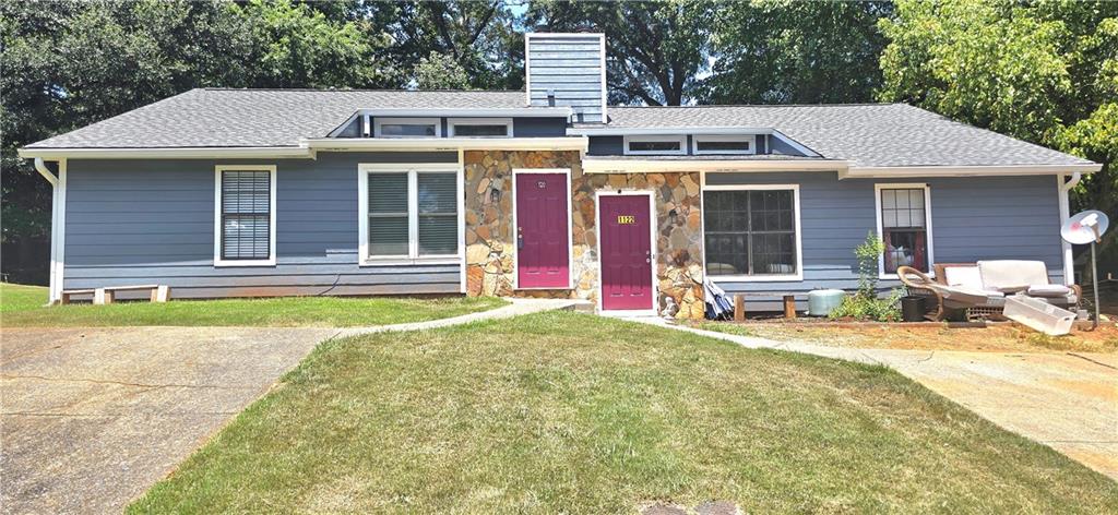 1120 Rappahannock Drive Alpharetta, GA 30009 - Photo 3 of 35 front view of a house with a patio