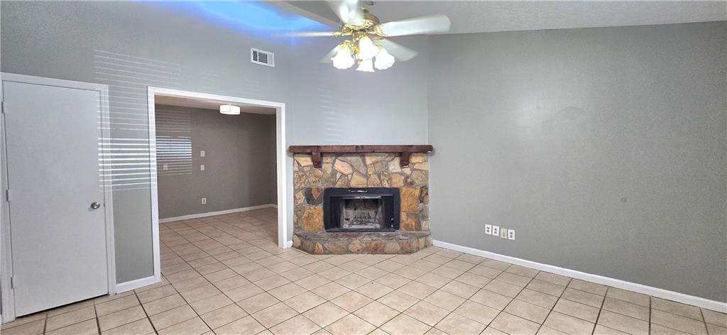 1120 Rappahannock Drive Alpharetta, GA 30009 - Photo 5 of 35 an empty room with windows and fireplace