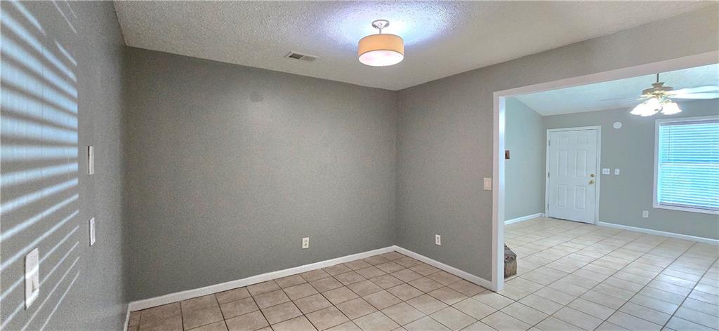 1120 Rappahannock Drive Alpharetta, GA 30009 - Photo 7 of 35 wooden floor in an empty room with a window