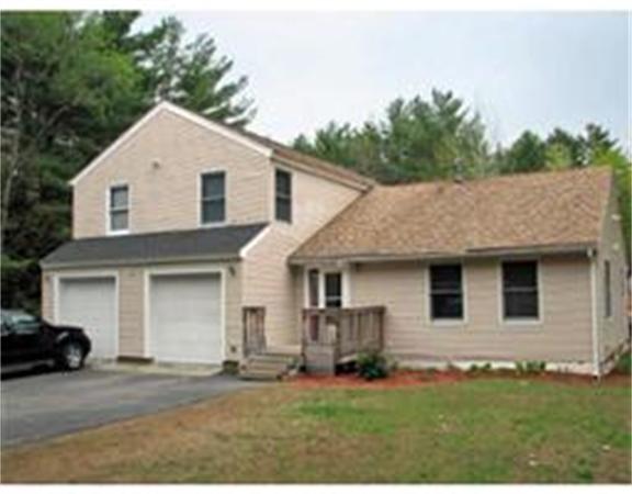760 Patriots Road Templeton, MA 01468 - Photo 1 of 1 a front view of a house with a yard and garage