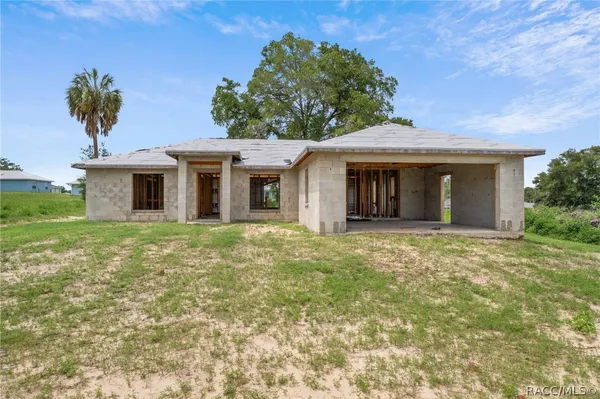 front view of a house with a yard