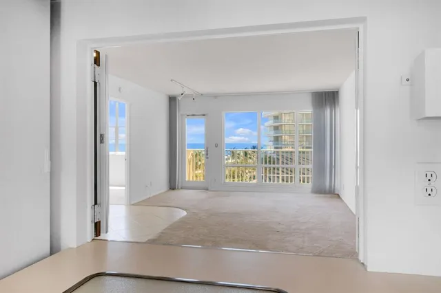 a view of an empty room and window