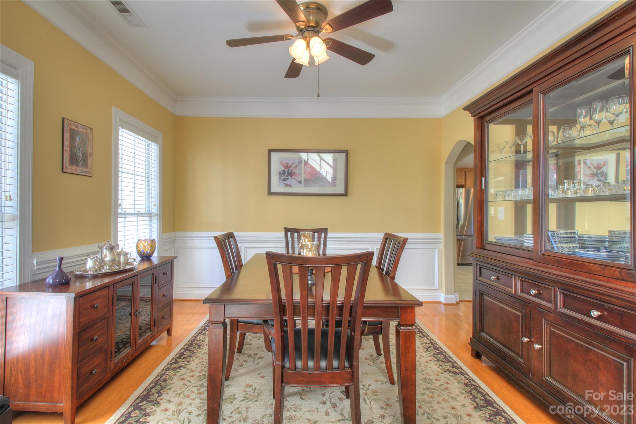 1016 Wesley Downs Road Wesley Chapel, NC 28110 - Photo 11 of 40 a view of a dining room with furniture window and wooden floor