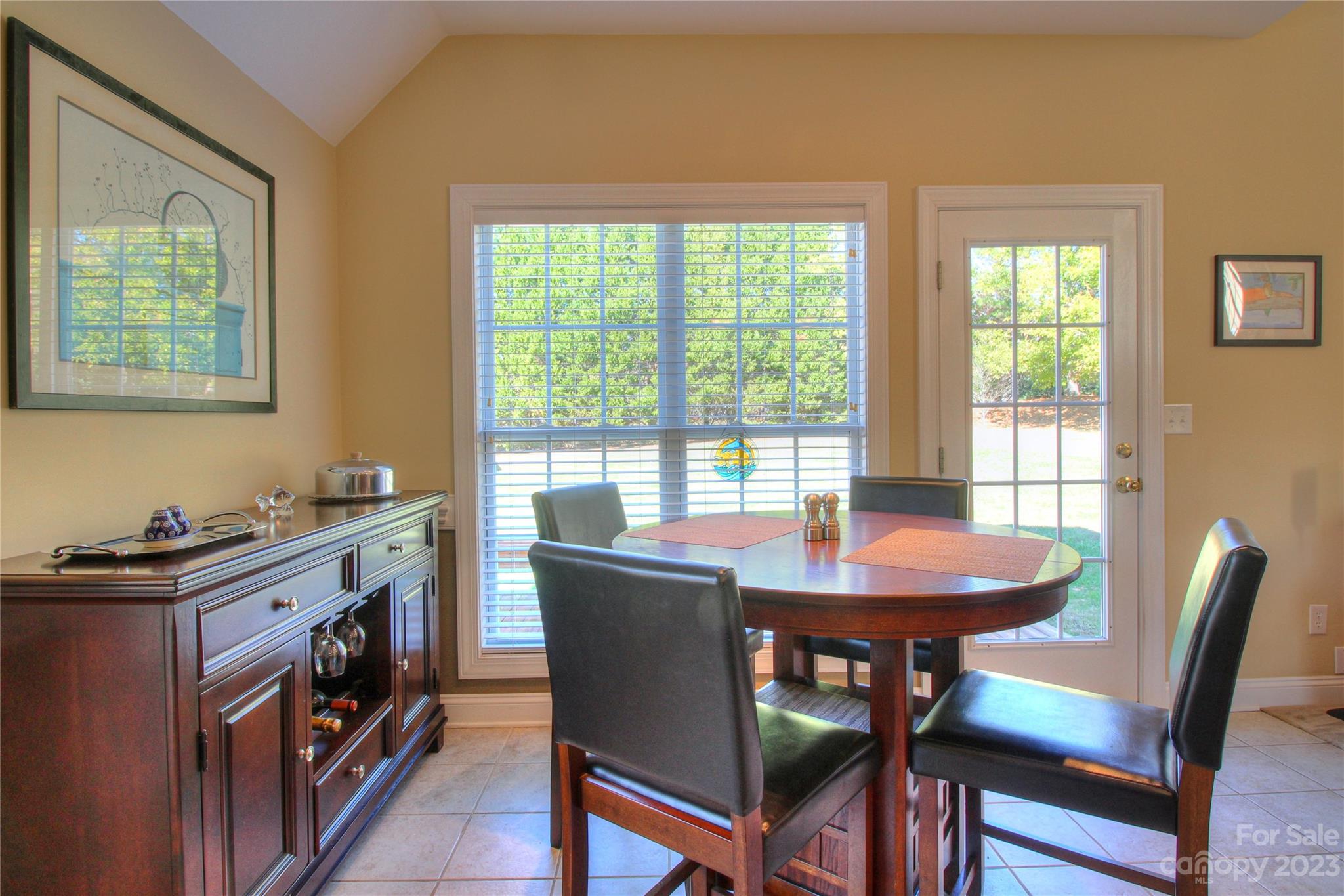 1016 Wesley Downs Road Wesley Chapel, NC 28110 - Photo 13 of 40 a view of a dining room with furniture and a window