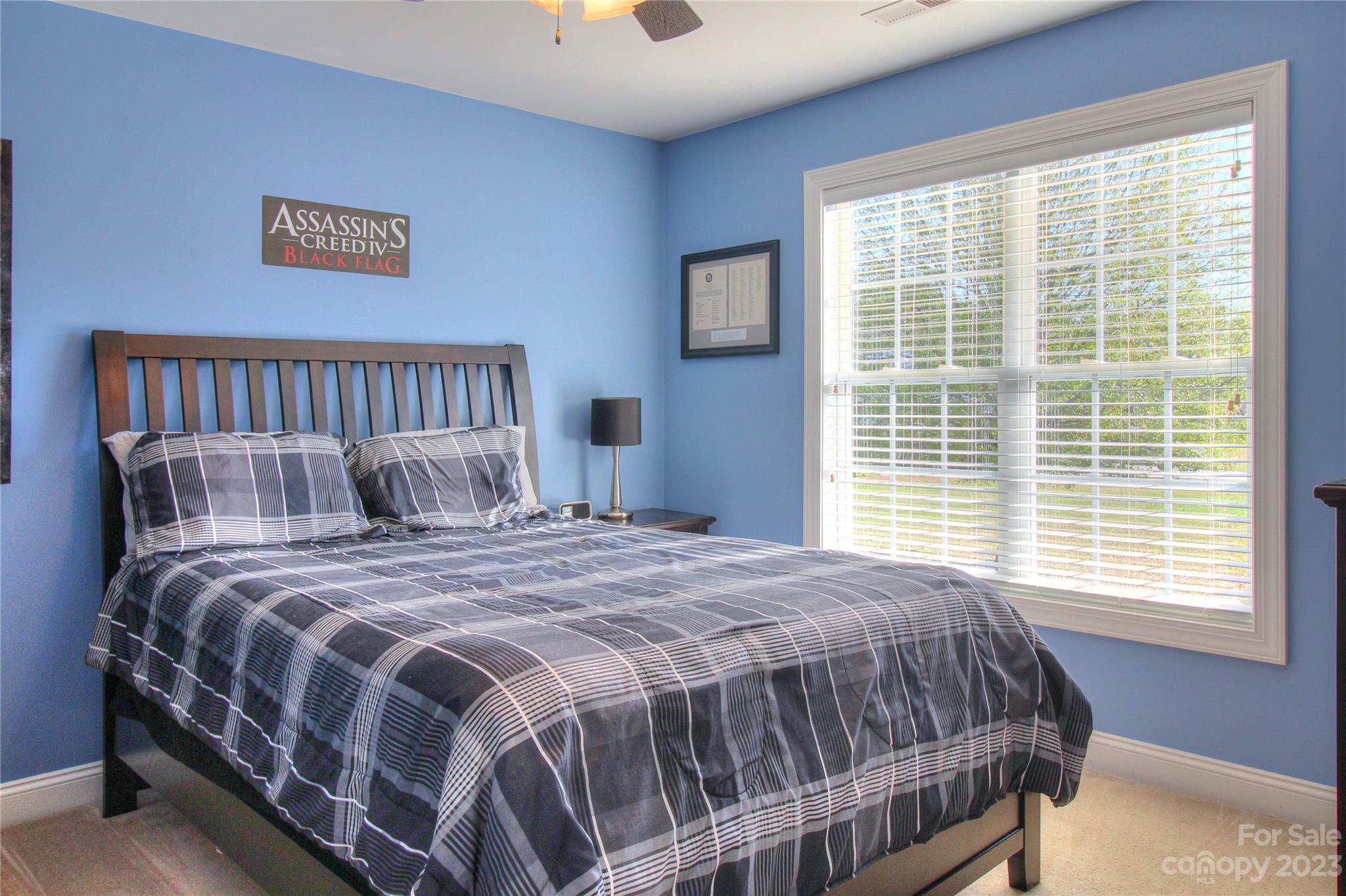 1016 Wesley Downs Road Wesley Chapel, NC 28110 - Photo 19 of 40 a bedroom with a bed and windows