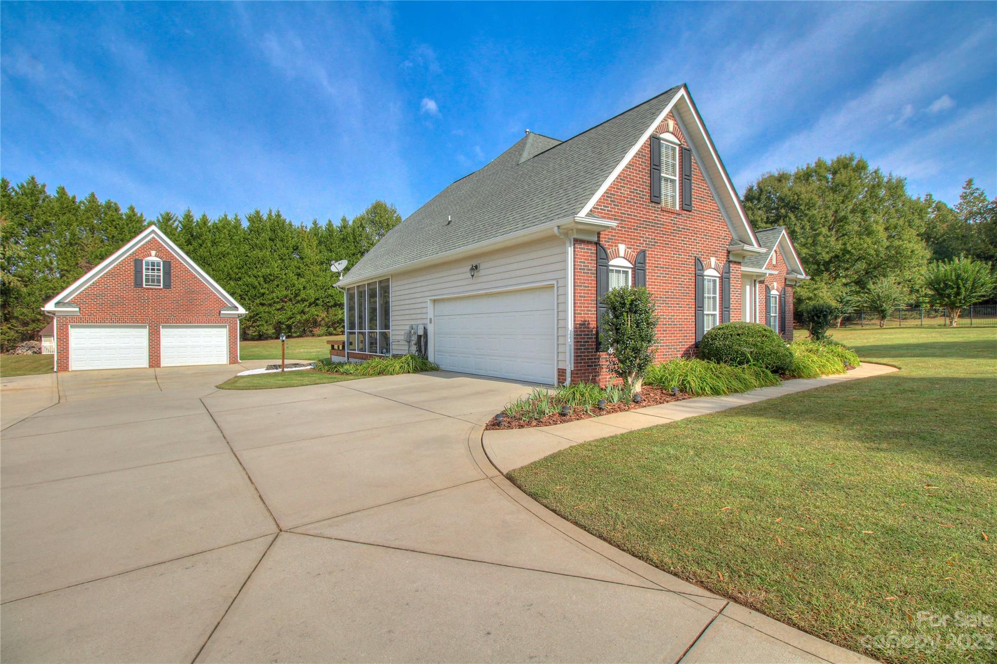 1016 Wesley Downs Road Wesley Chapel, NC 28110 - Photo 2 of 40 a front view of a house with garden