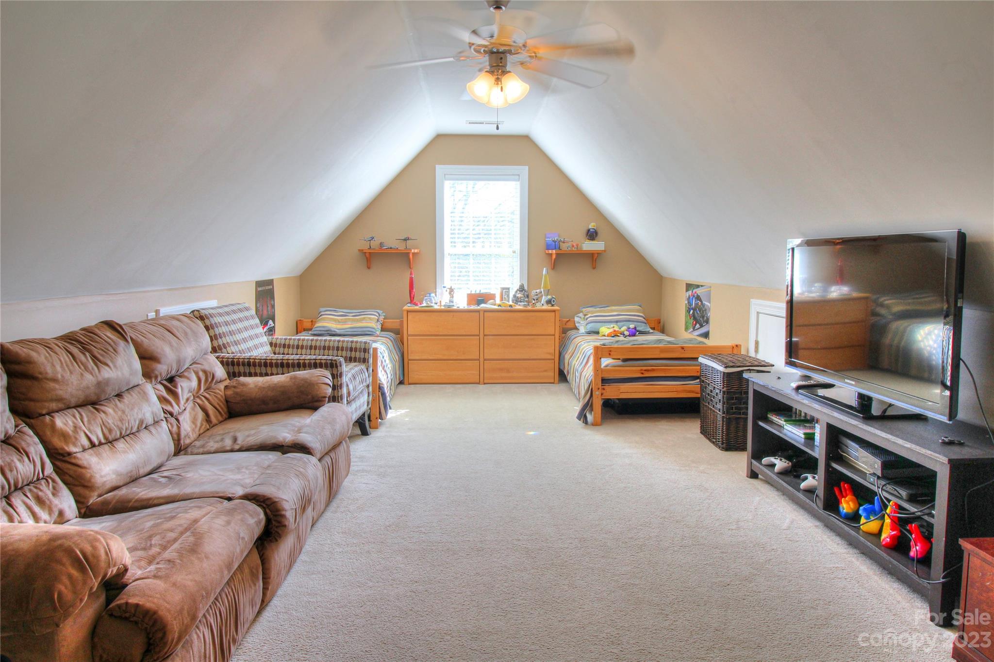 1016 Wesley Downs Road Wesley Chapel, NC 28110 - Photo 24 of 40 a living room with furniture and a flat screen tv