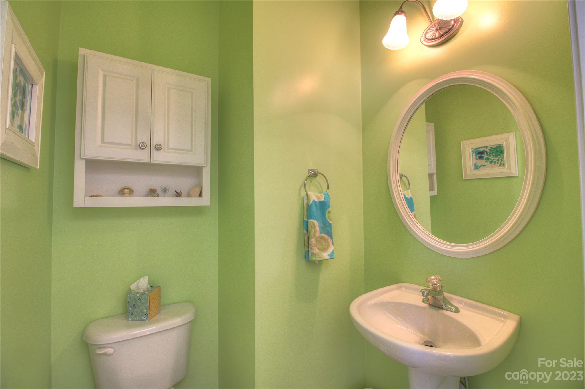 1016 Wesley Downs Road Wesley Chapel, NC 28110 - Photo 25 of 40 a bathroom with a toilet sink and mirror