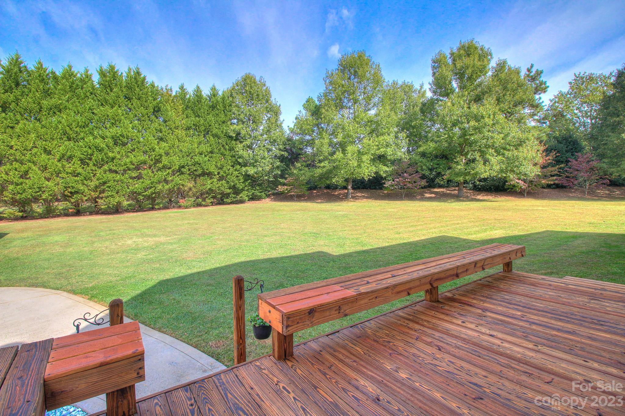 1016 Wesley Downs Road Wesley Chapel, NC 28110 - Photo 36 of 40 a view of a terrace with lawn chairs and wooden floor