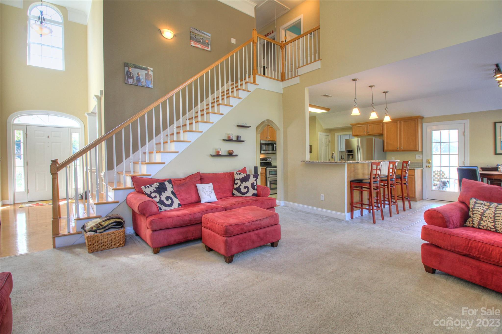 1016 Wesley Downs Road Wesley Chapel, NC 28110 - Photo 5 of 40 a living room with furniture and a dining table