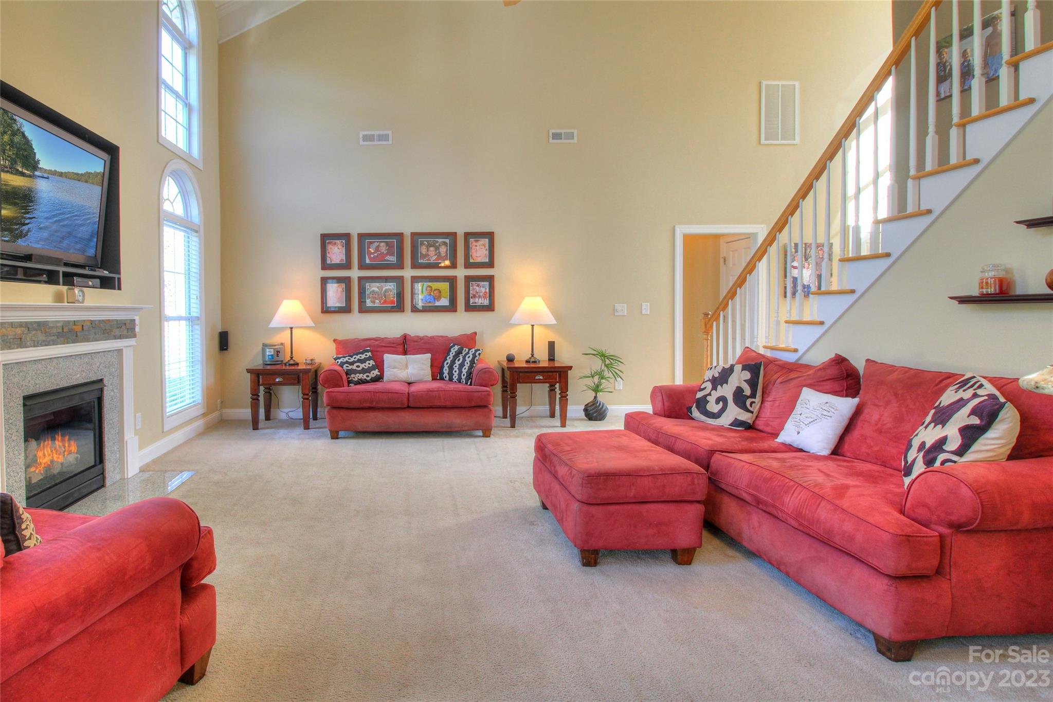 1016 Wesley Downs Road Wesley Chapel, NC 28110 - Photo 6 of 40 a living room with furniture fireplace and flat screen tv