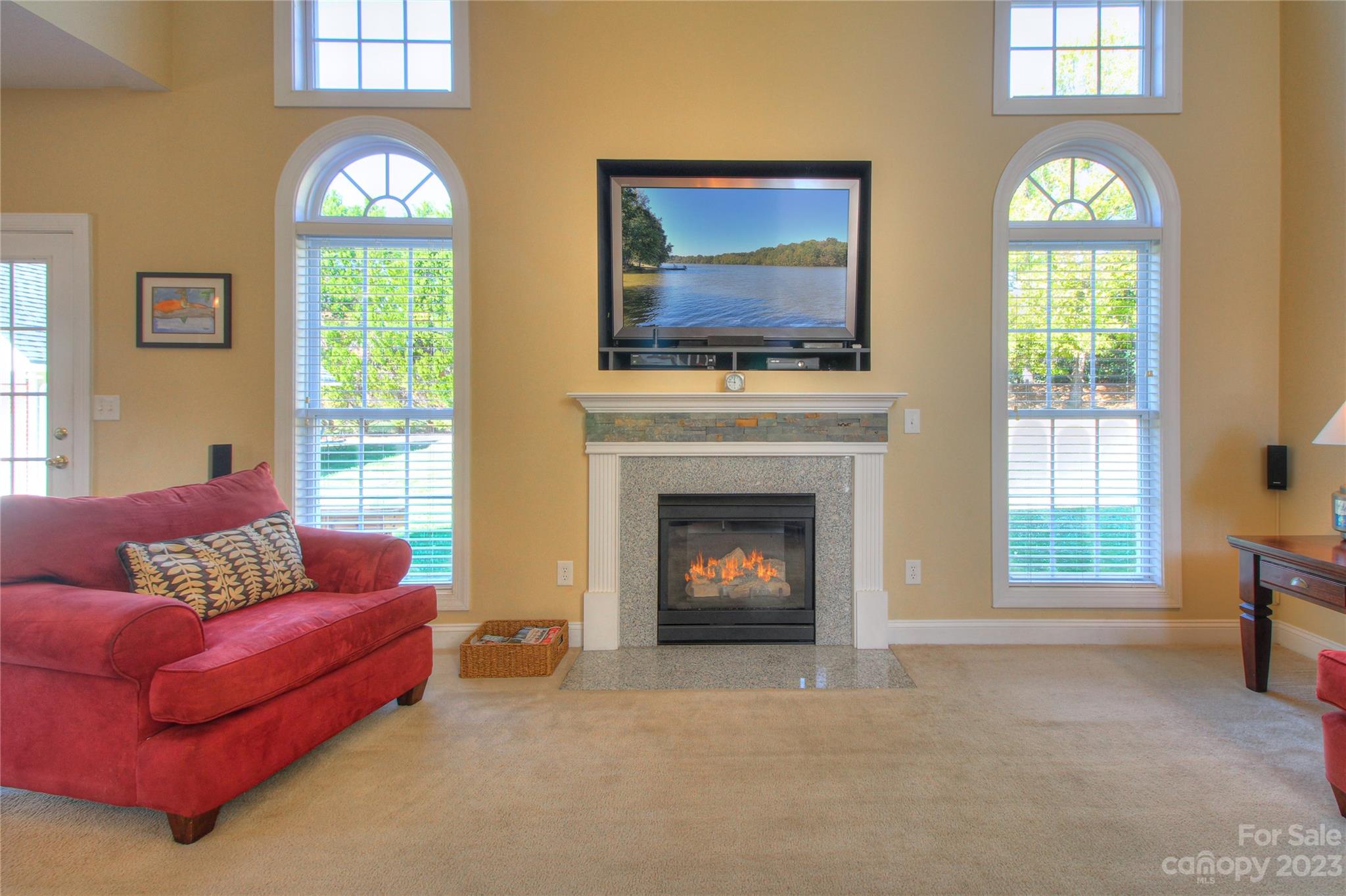 1016 Wesley Downs Road Wesley Chapel, NC 28110 - Photo 7 of 40 a living room with furniture and a flat screen tv