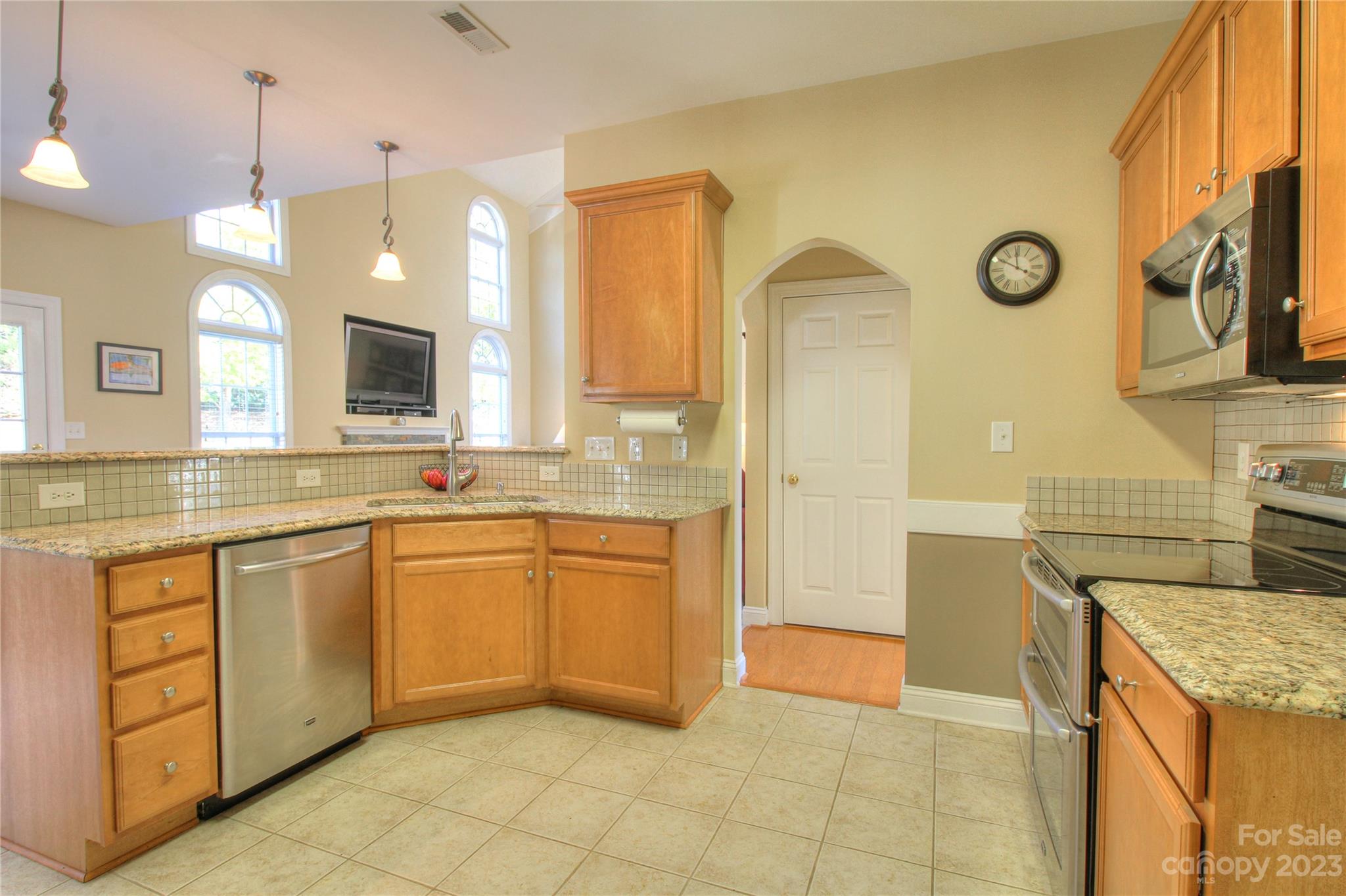 1016 Wesley Downs Road Wesley Chapel, NC 28110 - Photo 8 of 40 a large kitchen with stainless steel appliances granite countertop a sink and a cabinets