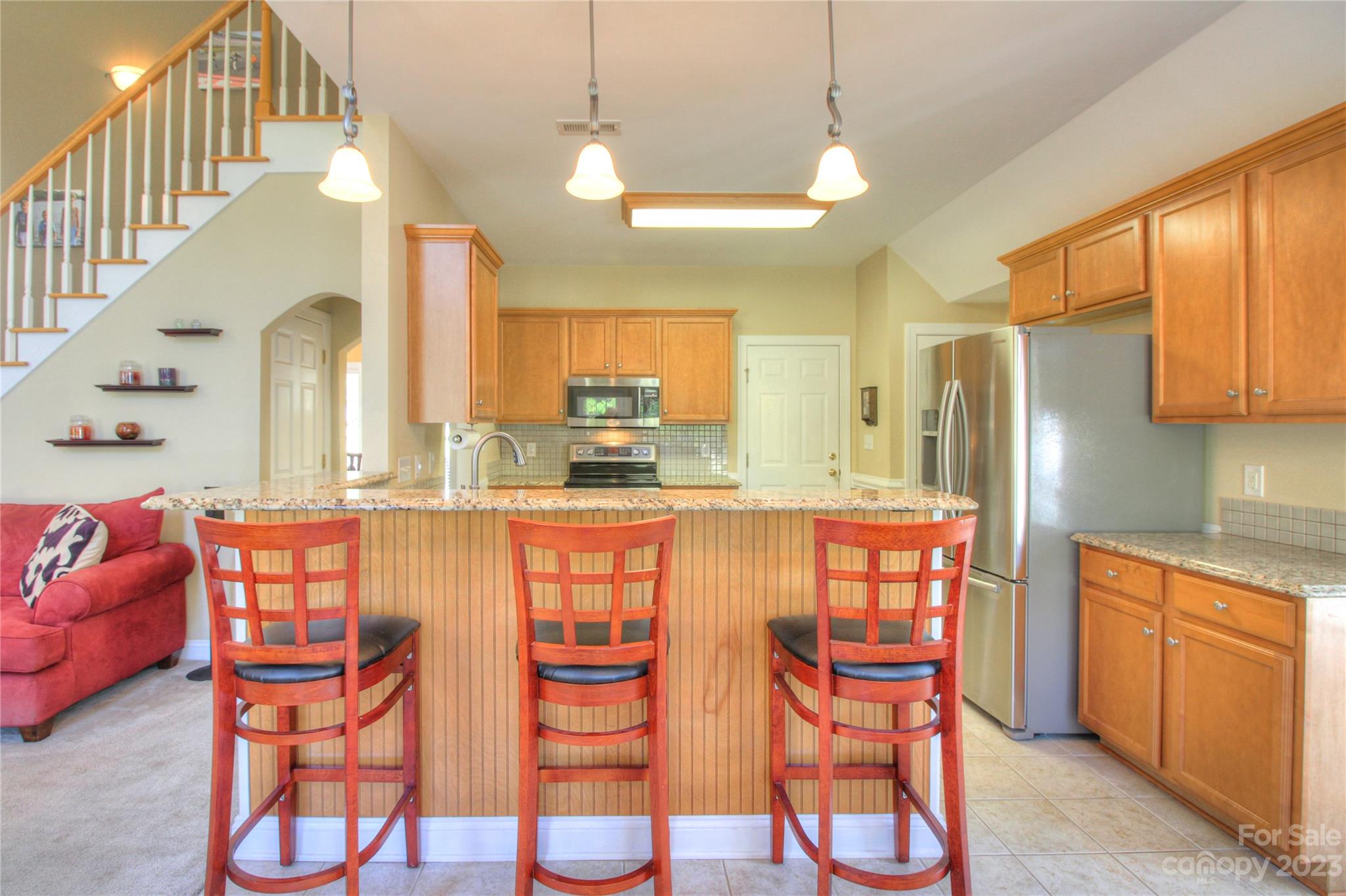 1016 Wesley Downs Road Wesley Chapel, NC 28110 - Photo 9 of 40 a large kitchen with a table and chairs in it