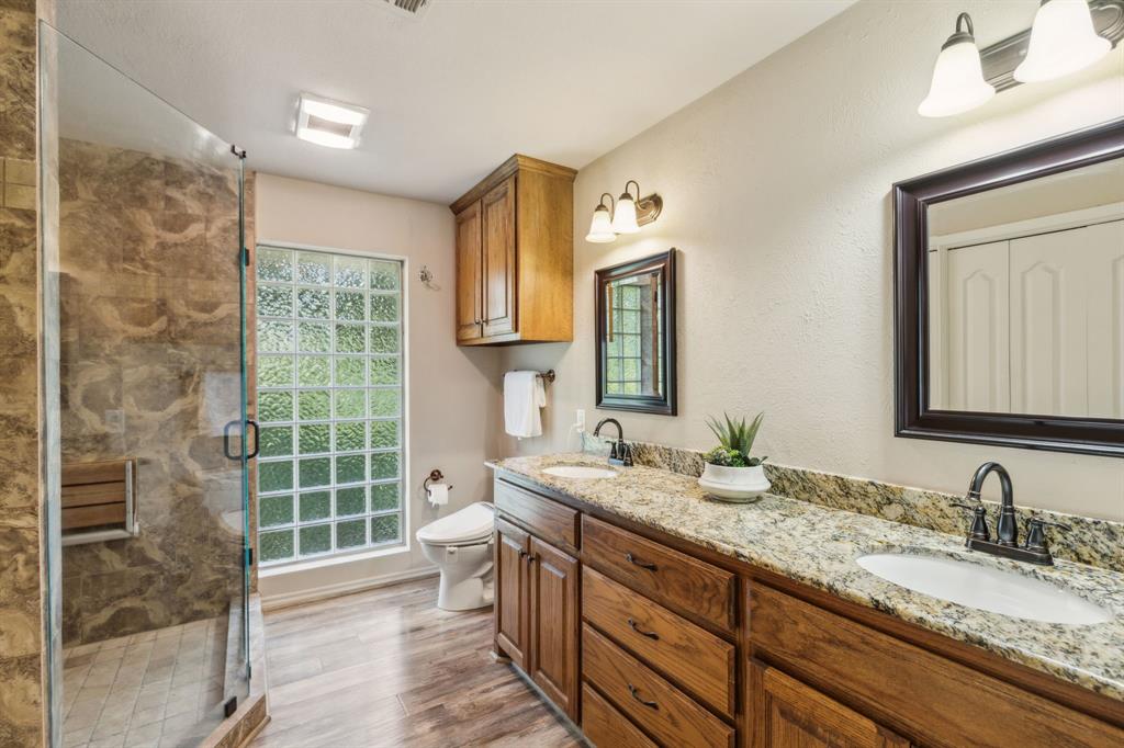 142 Peninsula Point Terrace Mabank, TX 75156 - Photo 11 of 29 a bathroom with a granite countertop sink mirror and double